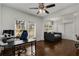 Spacious room with hardwood floors, multiple windows, ceiling fan and daybed sofa at 166 Erie Ave, Decatur, GA 30030