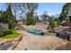 Sparkling pool and spa surrounded by a beautiful stone patio and lush greenery at 166 Erie Ave, Decatur, GA 30030