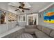 Bright sunroom with cozy seating, fan, and easy access to the home's interior at 166 Erie Ave, Decatur, GA 30030