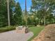 A large patio featuring a built-in grill and bar seating, perfect for outdoor entertaining at 9570 Huntcliff Trce, Atlanta, GA 30350