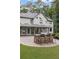 A large patio featuring a built-in grill and bar seating, perfect for outdoor entertaining at 9570 Huntcliff Trce, Atlanta, GA 30350