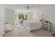 Bright bedroom with neutral color palette, bay window with desk, and plush dog bed at 9570 Huntcliff Trce, Atlanta, GA 30350