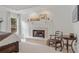 Main bedroom featuring a fireplace and ample natural light at 9570 Huntcliff Trce, Atlanta, GA 30350