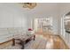 Open-concept living room with hardwood floors and view to the updated kitchen at 9570 Huntcliff Trce, Atlanta, GA 30350