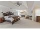 Spacious main bedroom with a fireplace and ample natural light at 9570 Huntcliff Trce, Atlanta, GA 30350