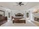 Spacious main bedroom with coffered ceilings, a fireplace, and ample natural light at 9570 Huntcliff Trce, Atlanta, GA 30350