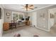 Spacious office with large desk setup, natural lighting, and neutral-toned carpet at 9570 Huntcliff Trce, Atlanta, GA 30350
