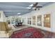 Bright sunroom featuring a pool table, skylights, tile floors, and ample natural light at 9570 Huntcliff Trce, Atlanta, GA 30350