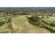 Aerial view of the surrounding golf course, lush greenery, and neighborhood trees at 2484 Oldfield Nw Rd, Atlanta, GA 30327