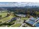 Aerial view of the neighborhood tennis courts, golf course and nearby skyline at 2484 Oldfield Nw Rd, Atlanta, GA 30327