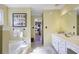 Traditional bathroom featuring a bathtub, vanity, and tiled flooring at 2484 Oldfield Nw Rd, Atlanta, GA 30327