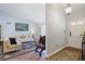Inviting entryway adjacent to the cozy living room, featuring warm wood floors and neutral decor at 2484 Oldfield Nw Rd, Atlanta, GA 30327