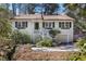 Charming home with a beautiful front yard, inviting entrance, and convenient attached garage at 2484 Oldfield Nw Rd, Atlanta, GA 30327