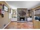 Living room featuring a stone fireplace, built-in shelves, and tiled flooring at 2484 Oldfield Nw Rd, Atlanta, GA 30327