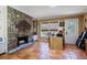 Comfortable living room with stone fireplace, tiled floors, and large windows at 2484 Oldfield Nw Rd, Atlanta, GA 30327