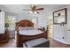 Spacious bedroom featuring a large bed, hardwood floors, and ample natural light at 2484 Oldfield Nw Rd, Atlanta, GA 30327