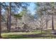 Neighborhood park featuring a playground surrounded by mature trees and green space at 2484 Oldfield Nw Rd, Atlanta, GA 30327