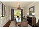 Elegant dining room featuring a large table, chairs, and stylish decor at 3195 Ne Wills Mill Ne Rd, Cumming, GA 30041