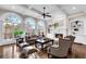 Comfortable living room with fireplace, coffered ceiling, and large windows at 3195 Wills Mill Rd, Cumming, GA 30041