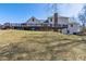 Large backyard with a wooden deck, ideal for outdoor activities and relaxation at 684 Old Cumming Rd, Sugar Hill, GA 30518
