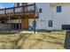 Spacious backyard featuring a covered patio with a walkout basement at 684 Old Cumming Rd, Sugar Hill, GA 30518