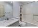 Bathroom with a combination bathtub and shower featuring white tile at 684 Old Cumming Rd, Sugar Hill, GA 30518