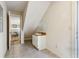 Bright bathroom with modern tile flooring, single sink vanity and access to the dining area at 684 Old Cumming Rd, Sugar Hill, GA 30518