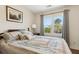 Bedroom featuring a large window with natural light and cozy, inviting decor at 684 Old Cumming Rd, Sugar Hill, GA 30518