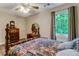 Charming bedroom featuring hardwood floors, and a large window at 684 Old Cumming Rd, Sugar Hill, GA 30518