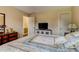 Bright bedroom with a TV and a large window at 684 Old Cumming Rd, Sugar Hill, GA 30518