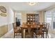 Inviting dining room with traditional décor and natural light streaming through the windows at 684 Old Cumming Rd, Sugar Hill, GA 30518