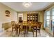 Cozy dining room with classic furnishings, including a china cabinet for display at 684 Old Cumming Rd, Sugar Hill, GA 30518