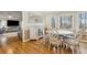 Bright dining room features hardwood floors, designer furniture, and views of the surrounding landscape at 684 Old Cumming Rd, Sugar Hill, GA 30518