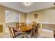 Dining room with a large wooden table and view of the staircase at 684 Old Cumming Rd, Sugar Hill, GA 30518