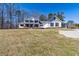 Beautiful two-story home with well-kept lawn and paved driveway at 684 Old Cumming Rd, Sugar Hill, GA 30518