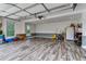 Spacious garage with stylish flooring, ample storage, and an abundance of natural light at 684 Old Cumming Rd, Sugar Hill, GA 30518