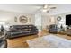Spacious living area with hardwood floors, comfortable leather seating, and stylish decor at 684 Old Cumming Rd, Sugar Hill, GA 30518