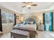 Comfortable main bedroom features a tray ceiling, tiled floors, and a bright, airy ambiance at 684 Old Cumming Rd, Sugar Hill, GA 30518