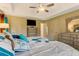 Charming main bedroom with a tray ceiling, tiled floors, and ample storage space at 684 Old Cumming Rd, Sugar Hill, GA 30518