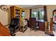 Office area with natural light, built-in shelves, and desk space at 684 Old Cumming Rd, Sugar Hill, GA 30518