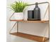 Stylish wooden shelf with a potted plant and decorative accessories at 2411 Fair Ln, Decatur, GA 30032