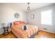 Bedroom with hardwood floors, a large window, neutral paint, and stylish decor at 2411 Fair Ln, Decatur, GA 30032