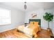 Cozy bedroom with hardwood floors and a modern color scheme at 2411 Fair Ln, Decatur, GA 30032