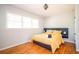 Cozy bedroom features hardwood floors, natural light, a stylish gray headboard, and contemporary decor at 2411 Fair Ln, Decatur, GA 30032