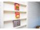 Close-up view of built-in shelves painted white, perfect for storing books and games at 2411 Fair Ln, Decatur, GA 30032