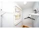 Well-organized closet space featuring shelving and natural light from a window at 2411 Fair Ln, Decatur, GA 30032