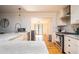 Bright, modern kitchen featuring a large island, stainless steel appliances, and a seamless connection to the dining area at 2411 Fair Ln, Decatur, GA 30032