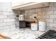 Close up of kitchen counter featuring a Keurig, storage canisters and marble tile backsplash at 2411 Fair Ln, Decatur, GA 30032