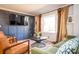 Cozy living room with a large window, stylish curtains, comfortable seating, and a decorative accent wall at 2411 Fair Ln, Decatur, GA 30032