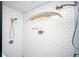Modern shower with white subway tile, showerheads, and a unique window at 2411 Fair Ln, Decatur, GA 30032